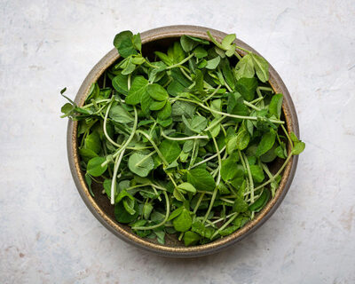 organic pea shoots in a bowl