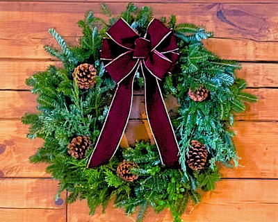vermont made evergreen wreath with bow and pine cones
