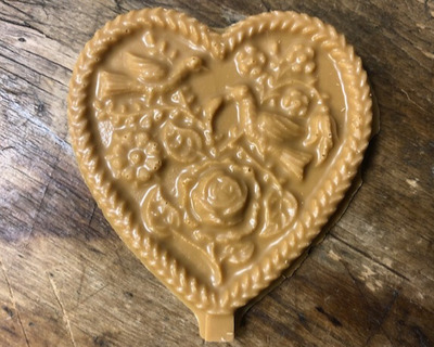 dulce de leche candy heart with birds and flowers on it