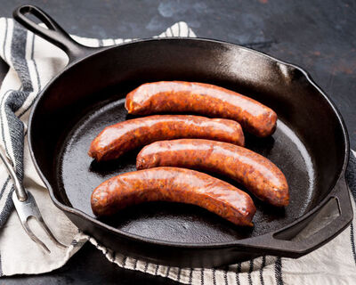 hot italian spicy sausage in cast iron skillet