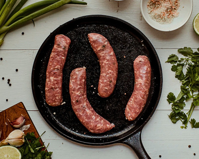 maple jalapeno sausages in a skillet